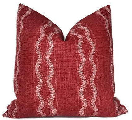 Zanzibar Pillow Cover in Red by Peter Dunham Textiles displayed on sofa