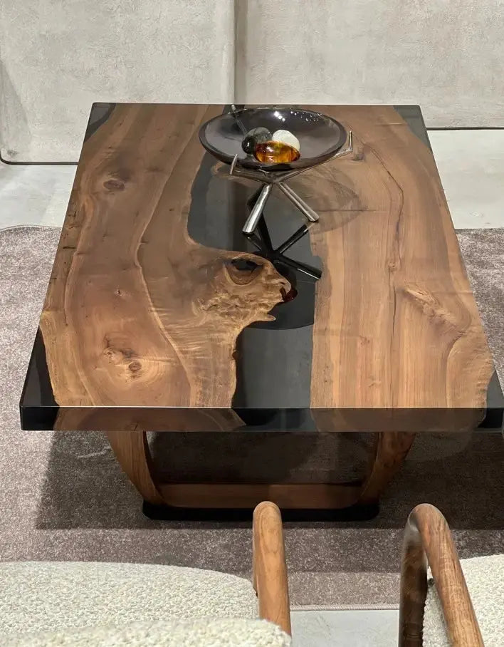 Handcrafted resin coffee table with smoke-colored resin river and solid walnut legs