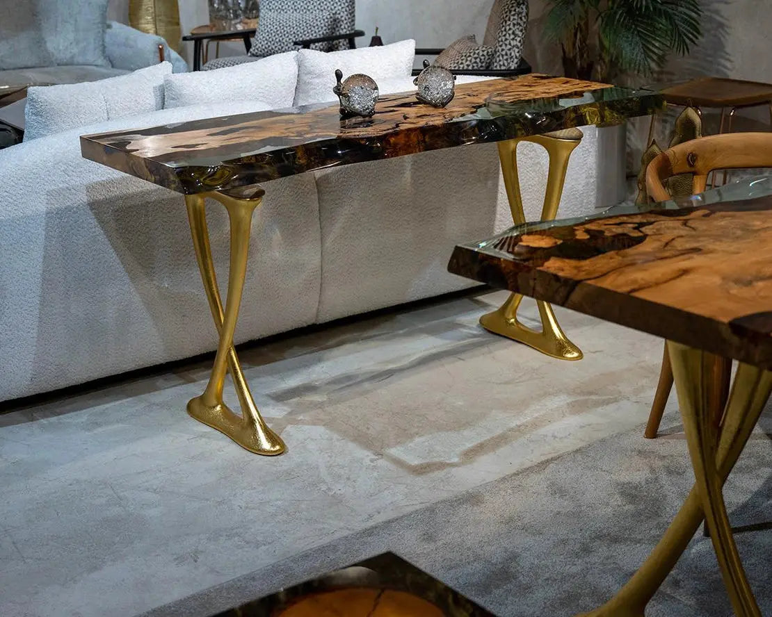 Handcrafted resin live edge console table made of aged linden wood with aluminum legs in a foyer setting