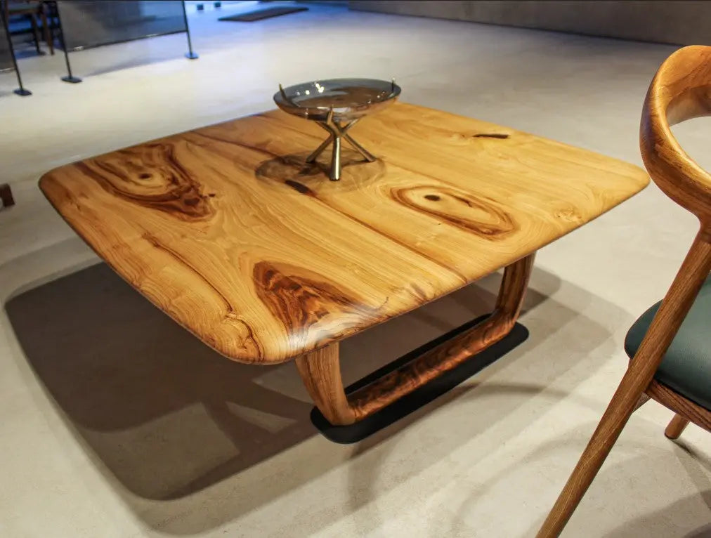 Rustic solid chestnut wood coffee table with chestnut legs in living room setting