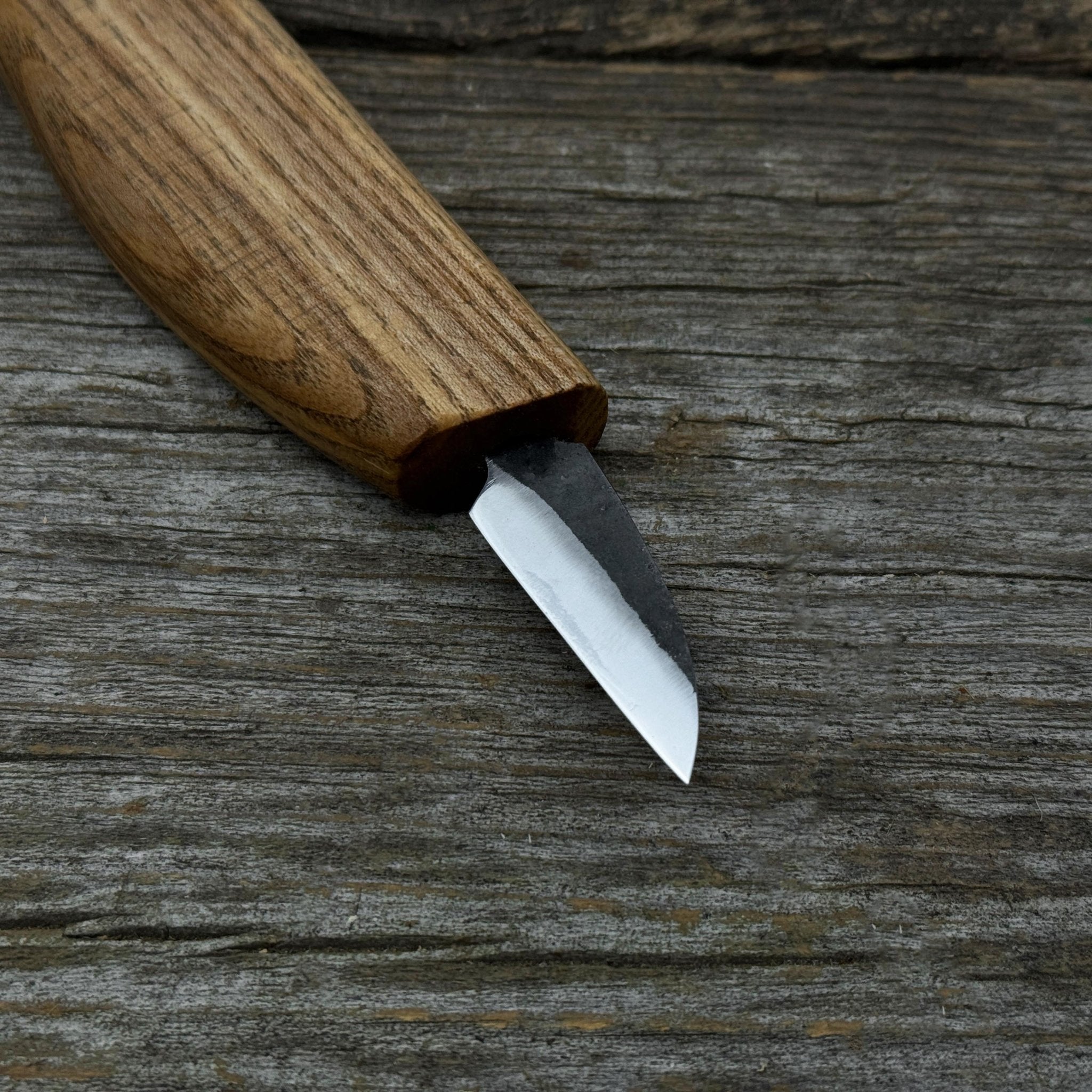Small whittling carving knife with fine-tipped blade and ergonomic ash wood handle by Sharky Forged Steel Tools