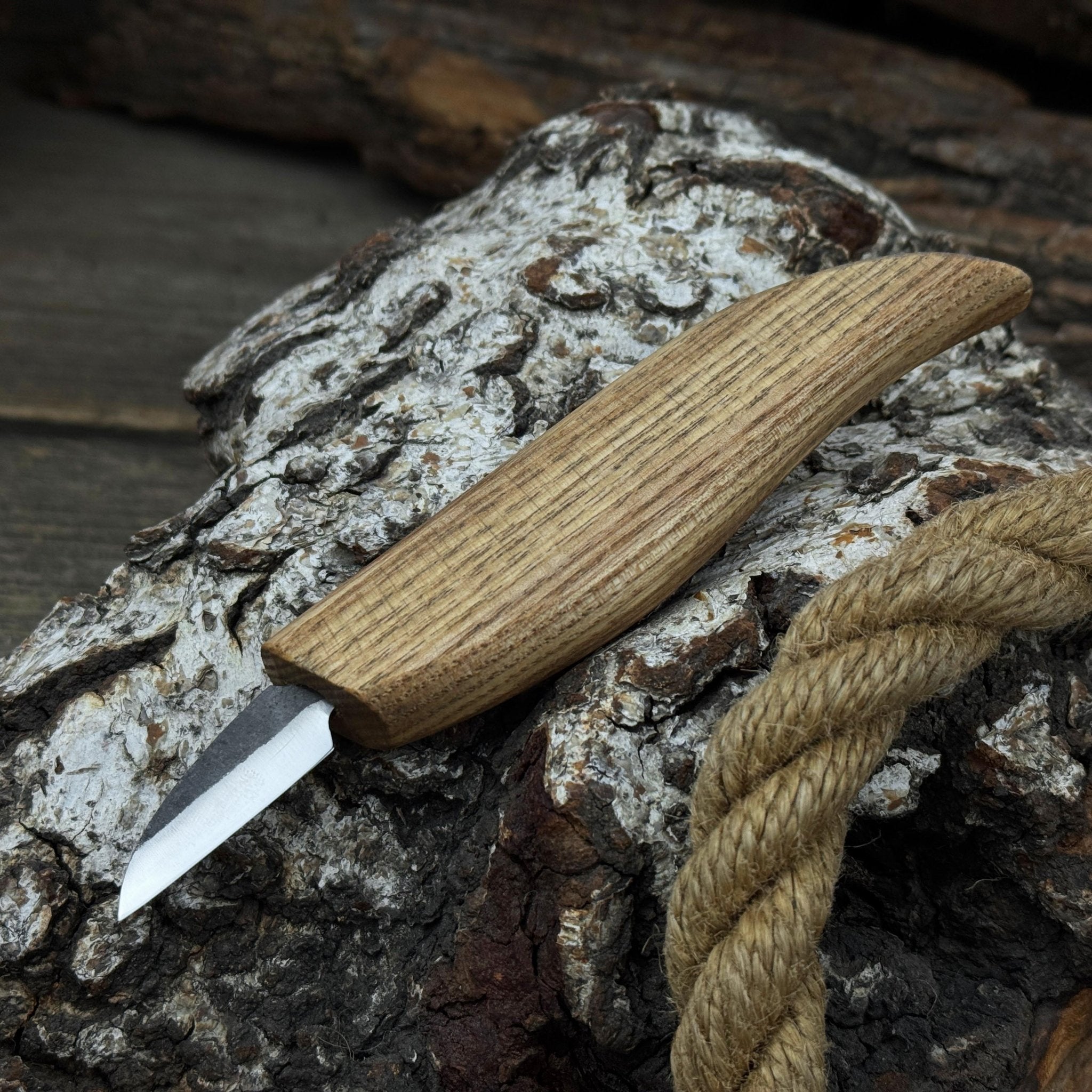 Small whittling carving knife with fine-tipped blade and ergonomic ash wood handle by Sharky Forged Steel Tools