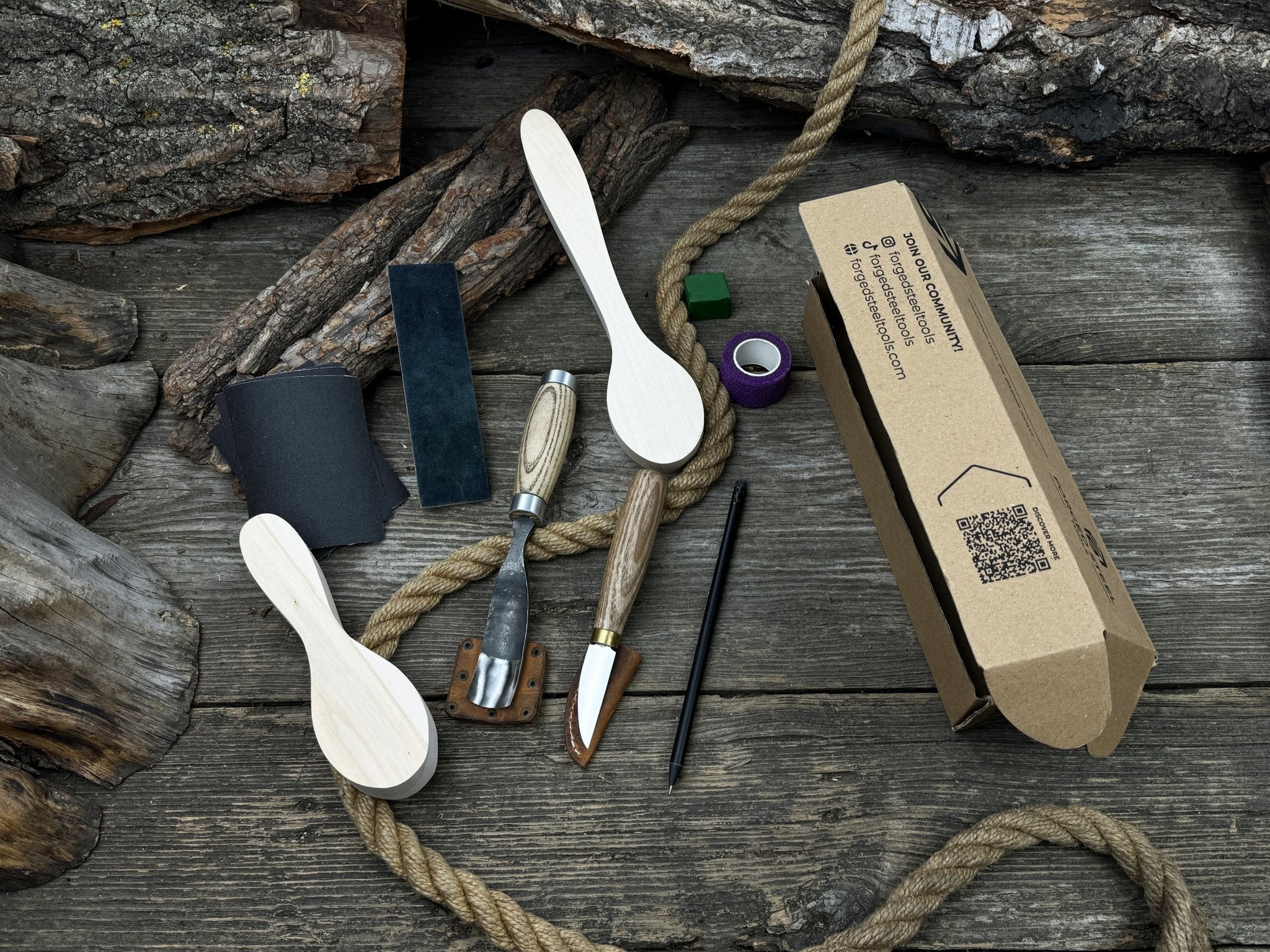 Complete Spoon Carving Kit with wood blanks, hand-forged tools, sandpaper, and accessories