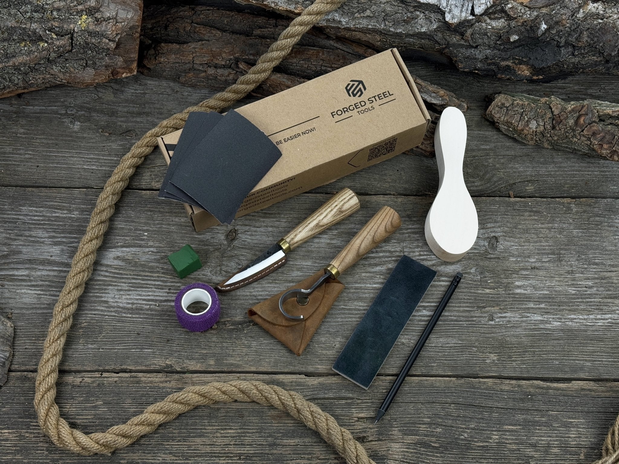 Spoon Carving Kit for Beginners with knives, wooden blank, sandpaper, and sharpening board