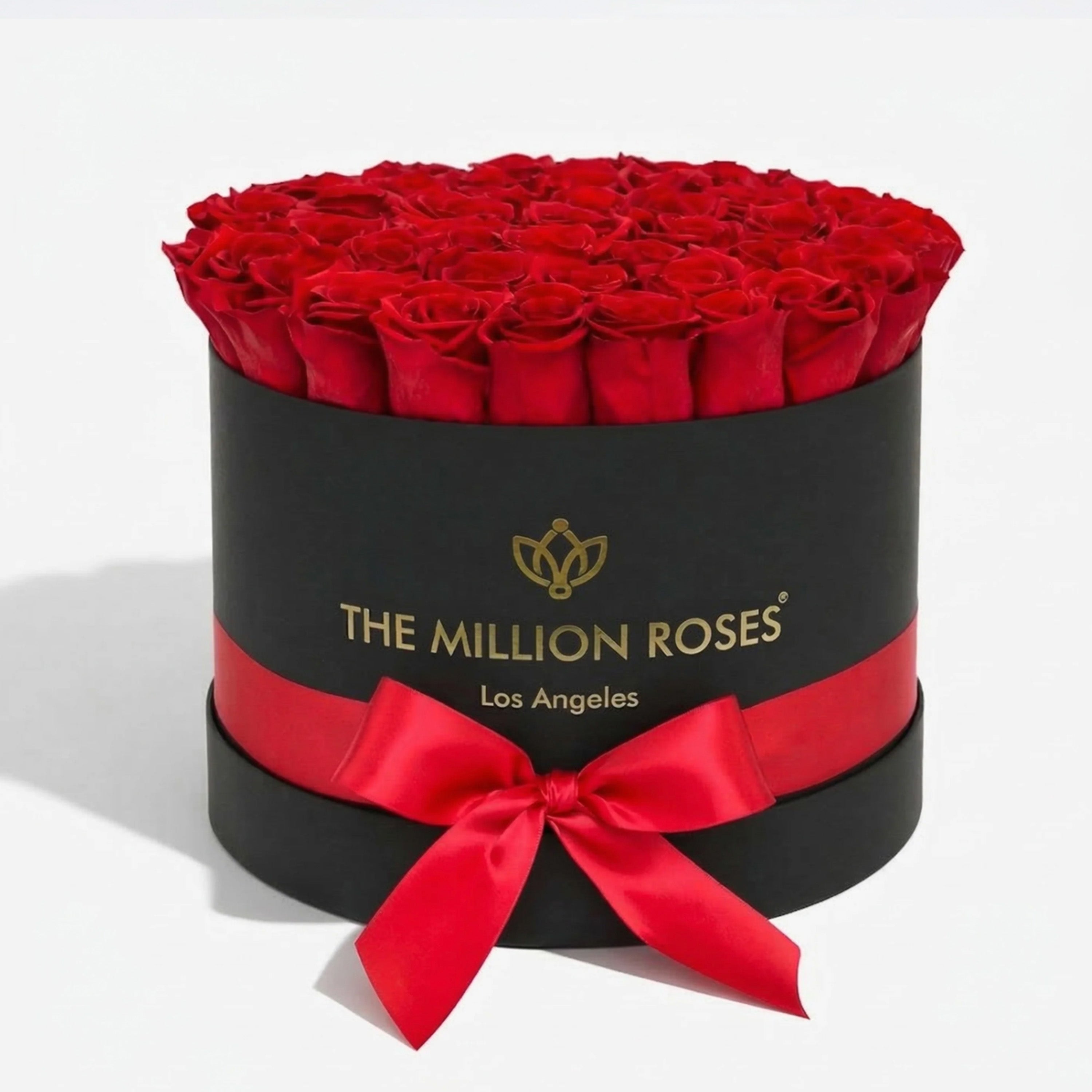 Black Supreme Box containing 26-28 naturally preserved red roses arranged tightly within.