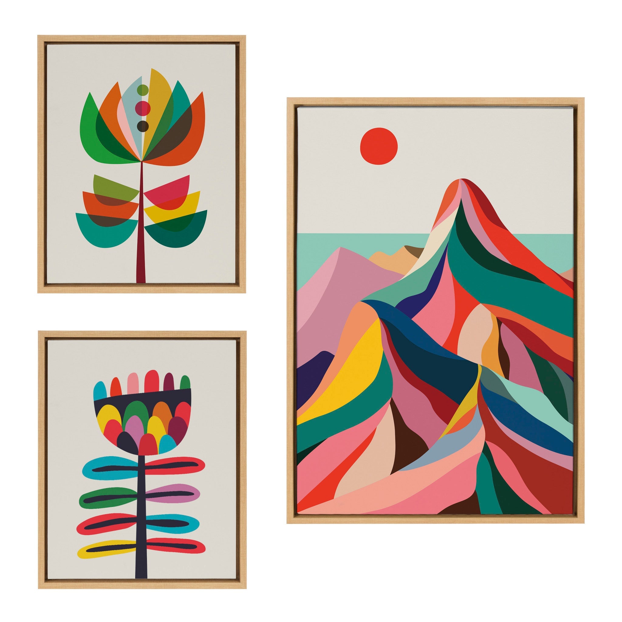 Three framed canvas artworks with mountain, botanical, and wildflower themes arranged together on a wall