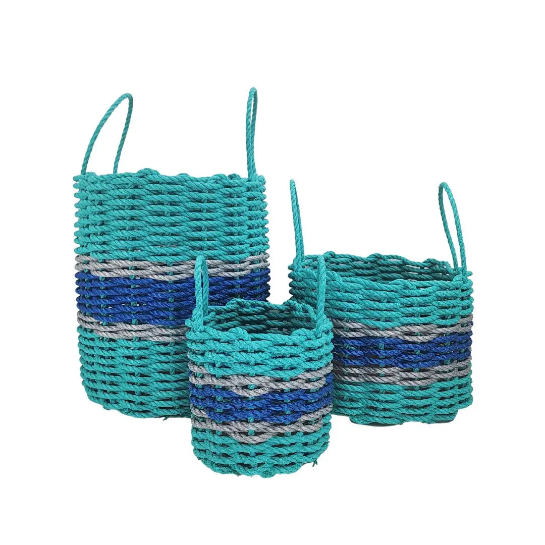 Handmade storage basket woven from teal and blue Maine lobster rope with light gray accents