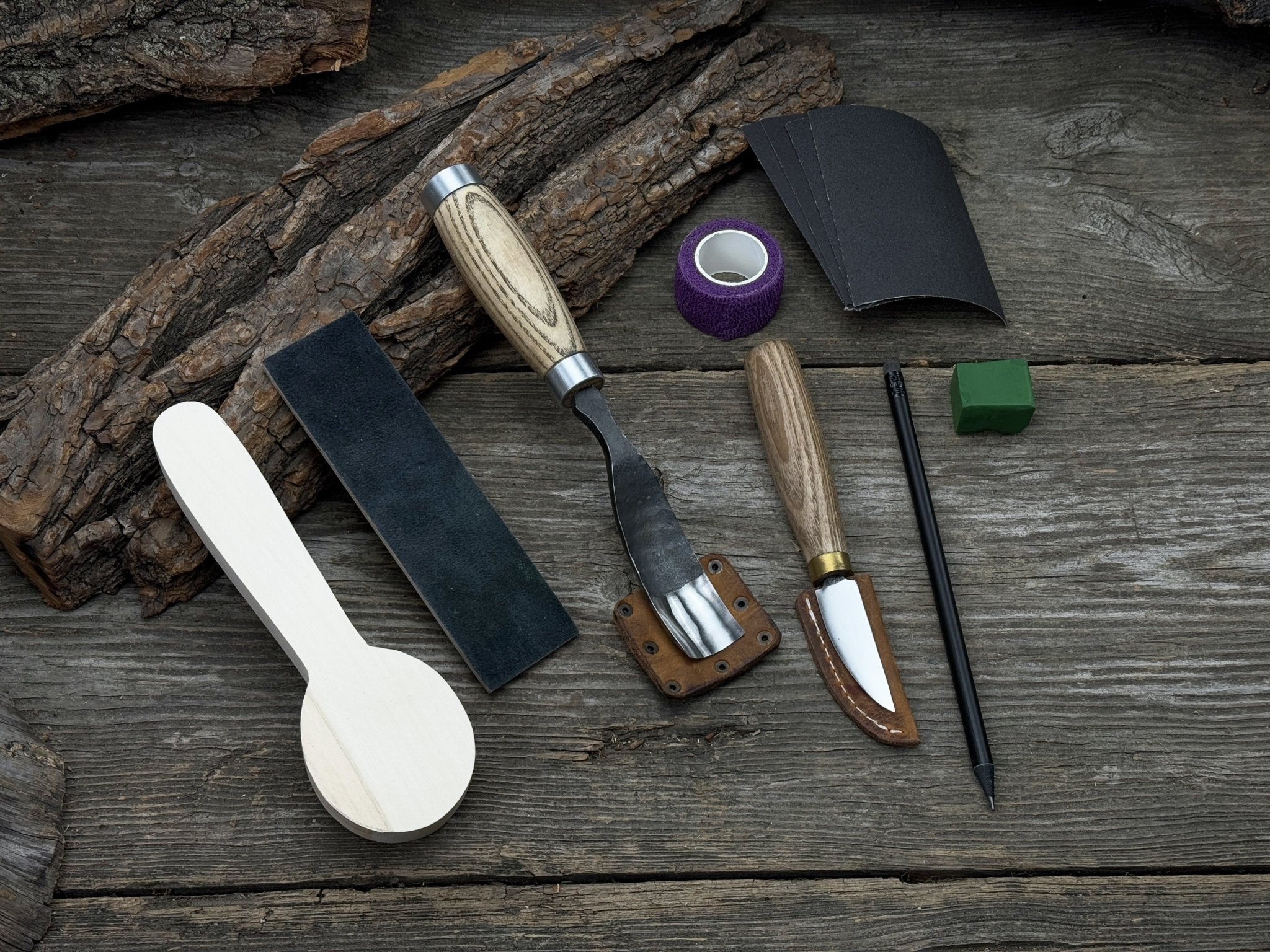 The Perfect Spoon Carving Kit for Beginners with tools, wooden blank, sandpaper, and sharpening board