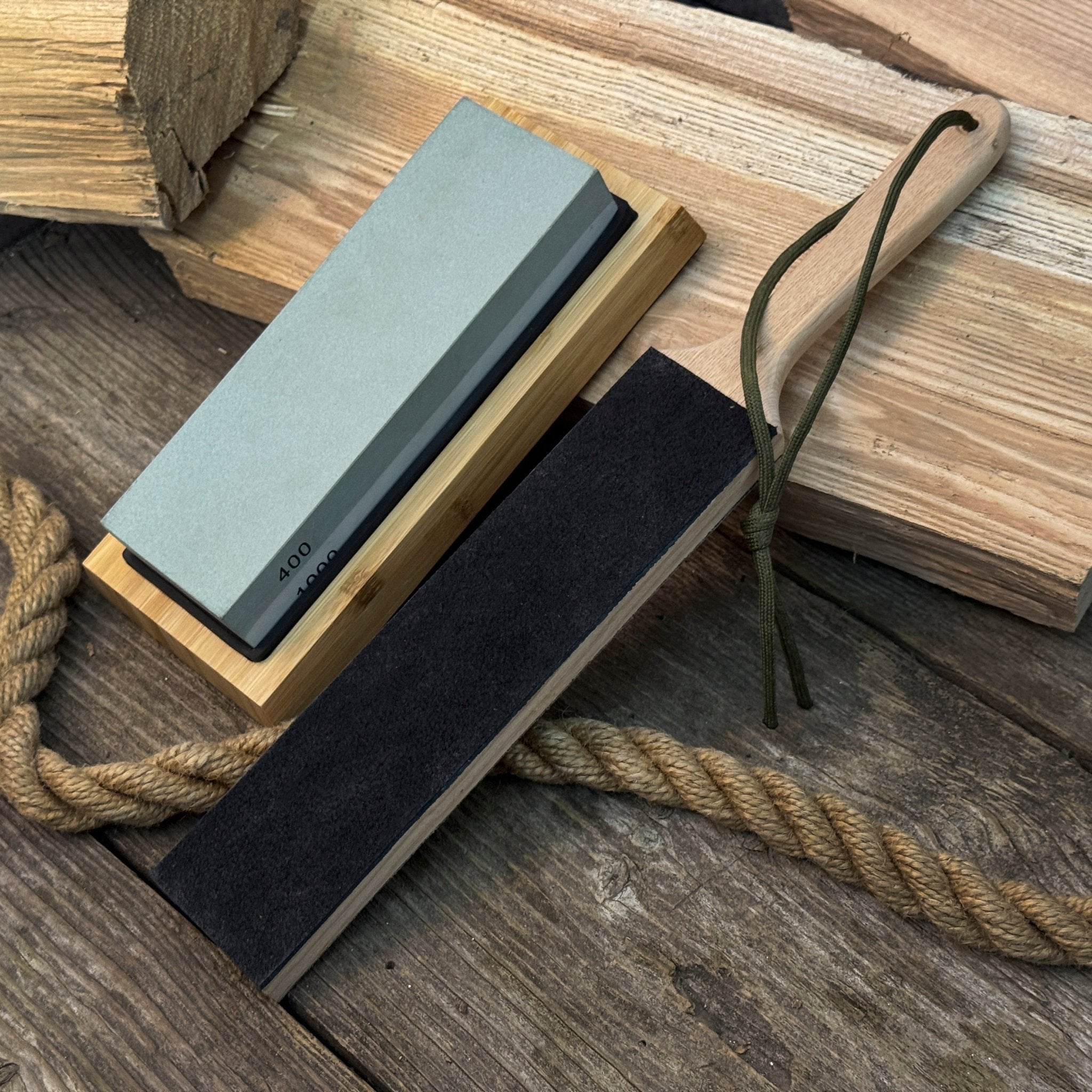 Universal Sharpening Kit including sharpening stones, leather strop, polishing compound, and wooden stand