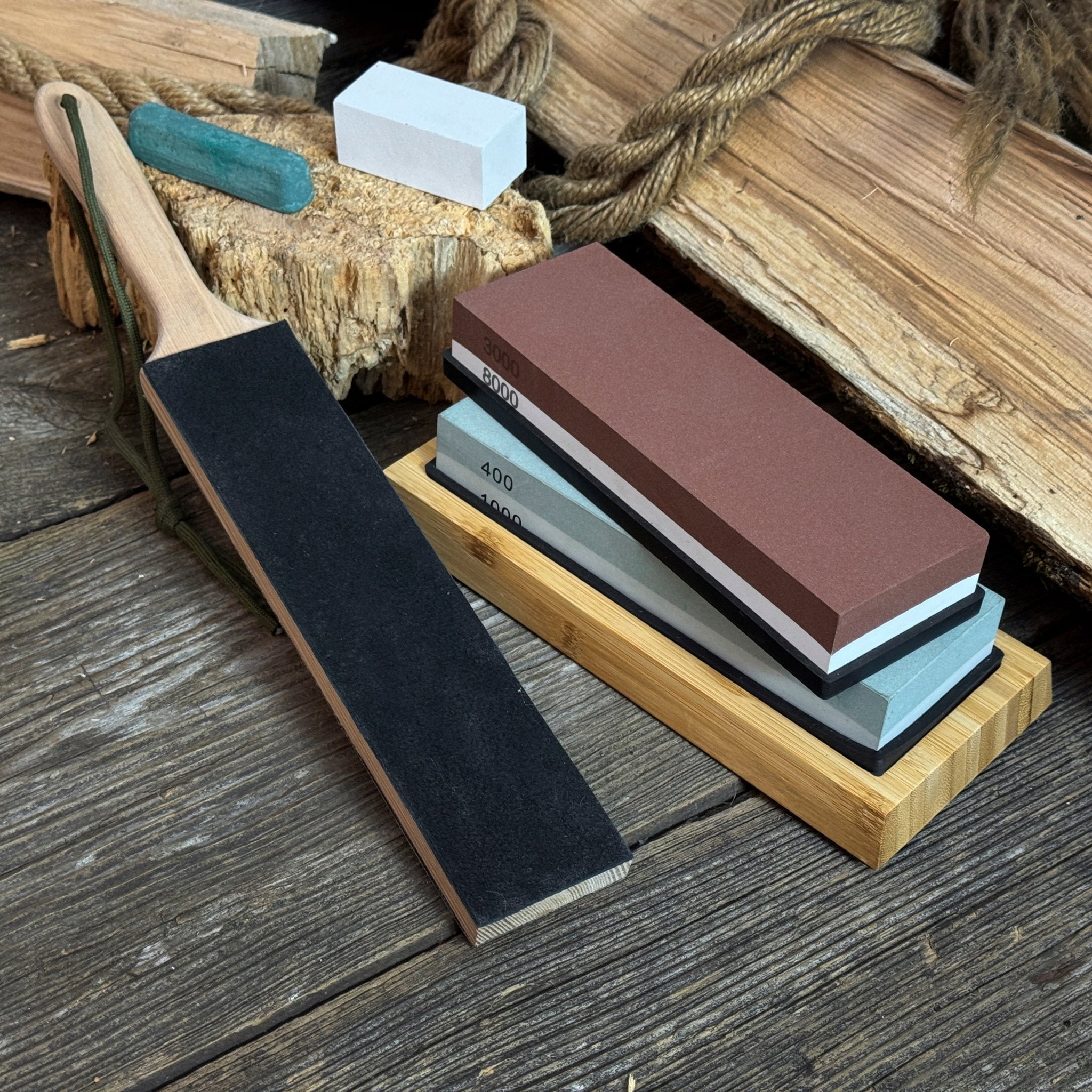 Universal Sharpening Kit including sharpening stones, leather strop, polishing compound, and wooden stand