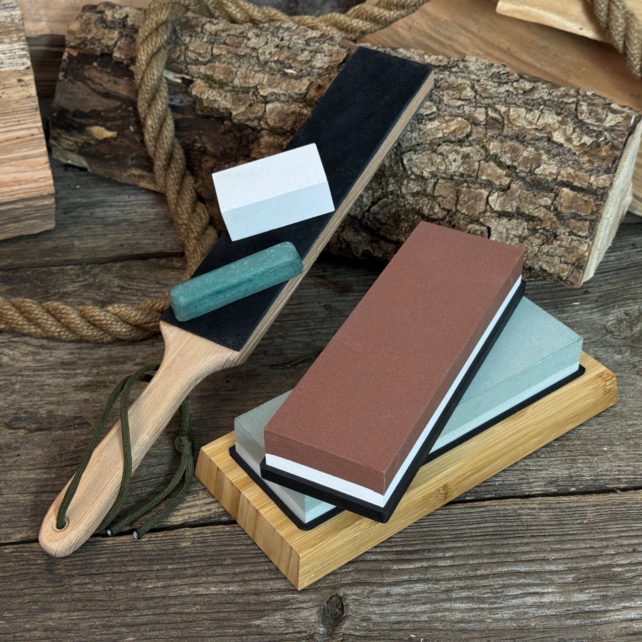 Universal Sharpening Kit including sharpening stones, leather strop, polishing compound, and wooden stand