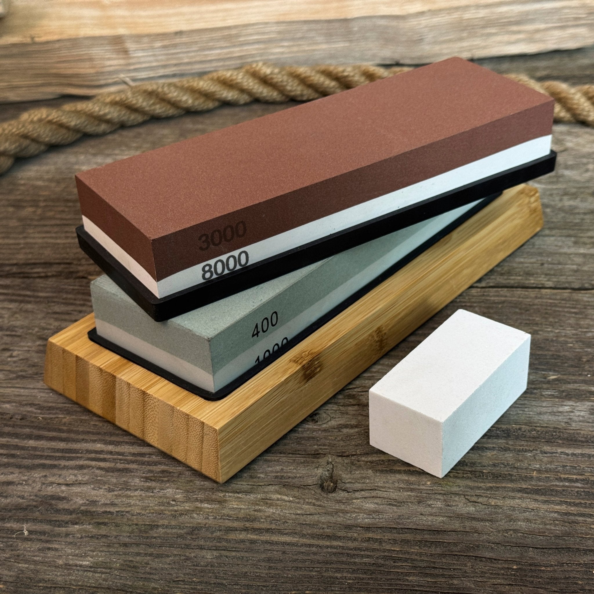 Universal Sharpening Kit including sharpening stones, leather strop, polishing compound, and wooden stand
