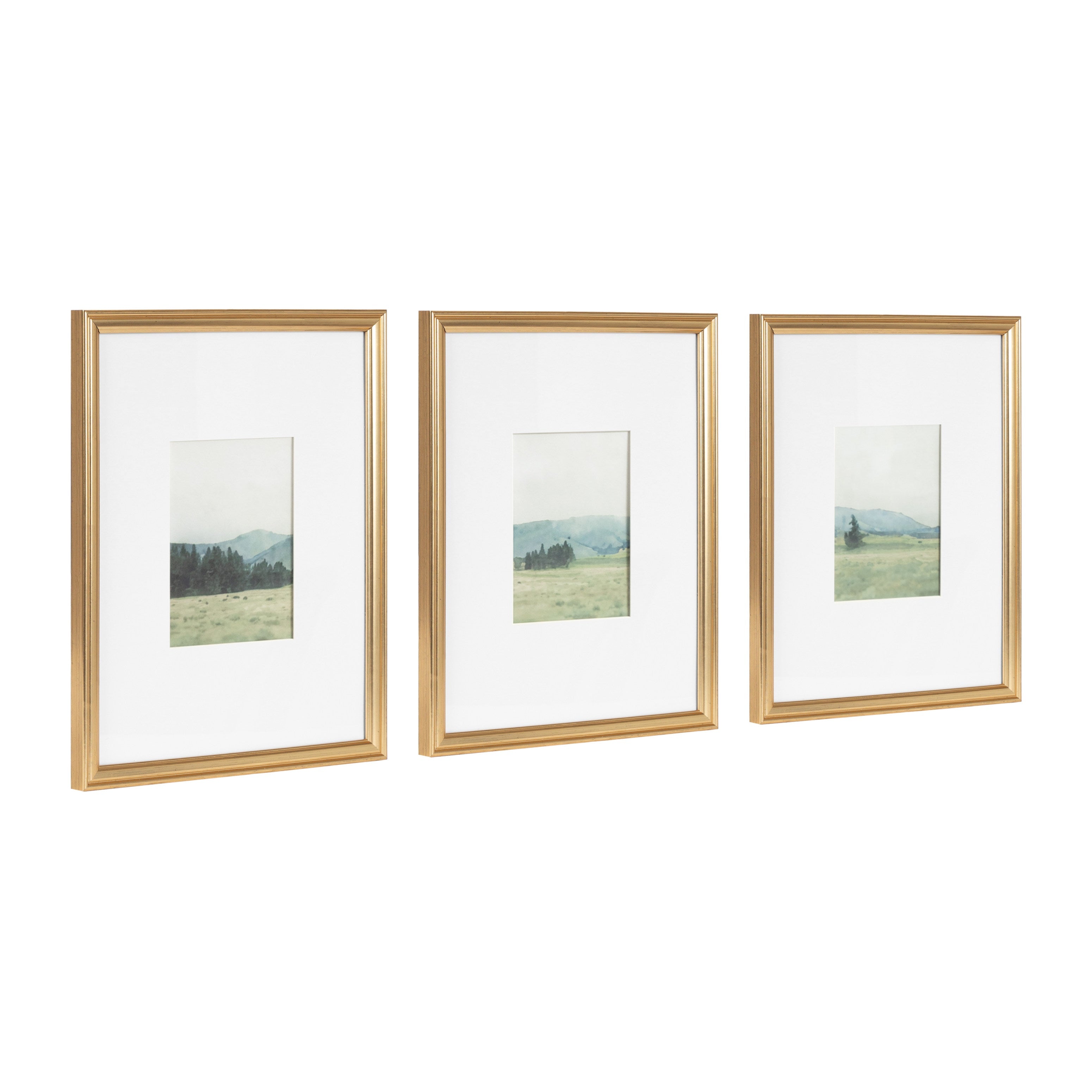 Three framed watercolor landscape artworks in vintage beveled frames arranged on a white wall