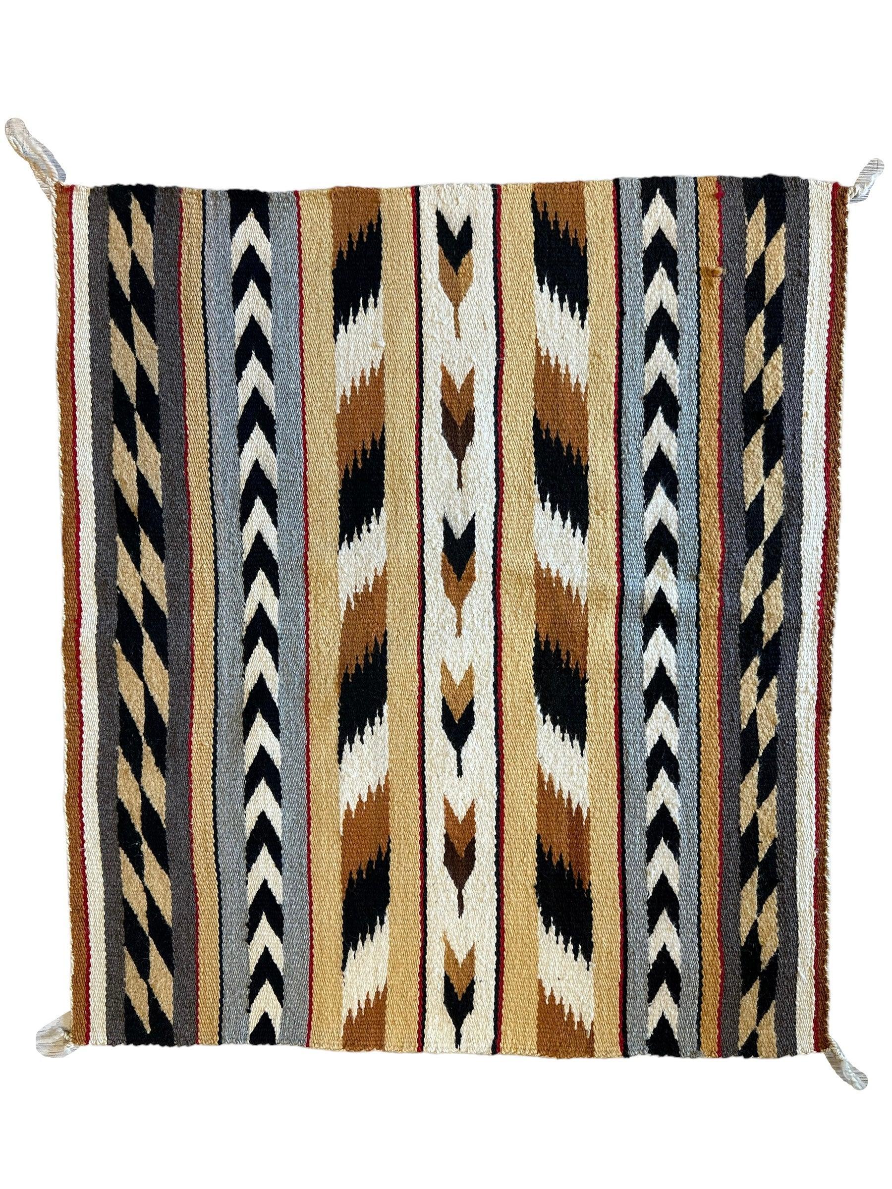 Vintage Native American Navajo Rug measuring 29 by 32 inches with traditional geometric patterns