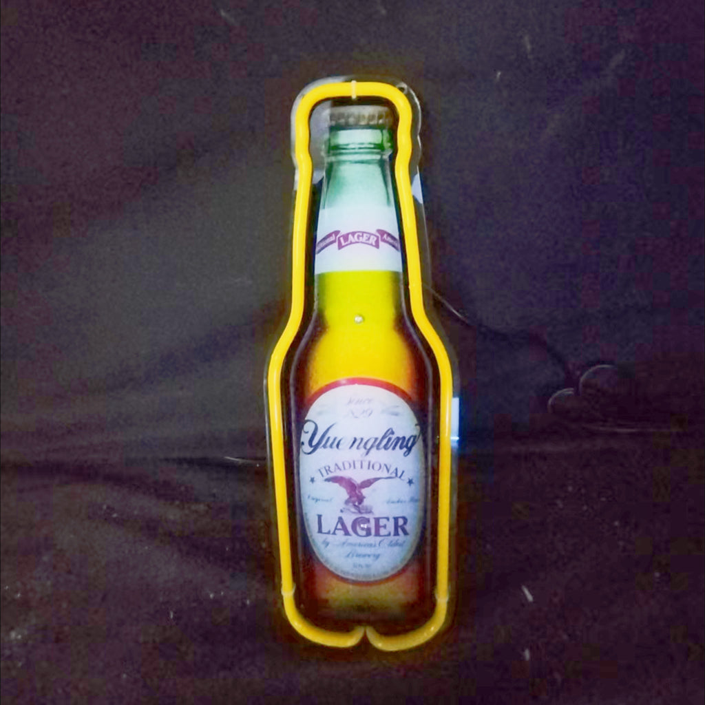 Yuengling Lager Bottle Neon Sign Light illuminated with a glowing outline of a beer bottle in warm yellow and red colors
