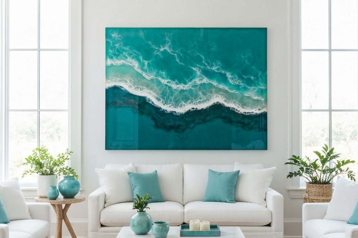 how to hang resin wall art shown as large ocean-inspired resin wall art in a bright coastal living room above a sofa