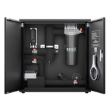 Black enclosed filtration system with visible pipe fittings, a large branded filter labeled RevX Wellness, and a white wrench mounted on the cabinet door interior.