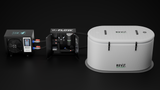 White oval-shaped RevX Wellness cold plunge tub with black handles and branding, positioned beside an open black X-FLOW filtration system unit and a gray control box connected by tubes.