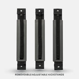 Three identical black and gray adjustable kickstands with textured gray panels, black straps, and metal snap buttons, arranged vertically on a white background.