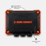 Black rectangular device with orange trim and four orange corner bolts, labeled Dark Energy, featuring textured Diamond-Tech grip and Armor-Flex edge protection.