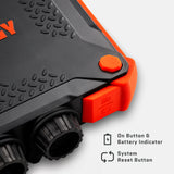 Close-up of rugged black and orange Poseidon XL Power Bank corner showing textured surface, two black circular ports, and orange system reset and battery indicator buttons.