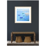 Framed painting of small blue and green boats floating on calm blue water near a sandy shoreline, hanging on a dark gray wall above a rustic wooden bench with two woven baskets underneath.