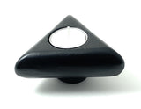 Vibhsa Unique Candle Holder in rustic black finish holding a taper candle and a tealight candle on a wooden surface