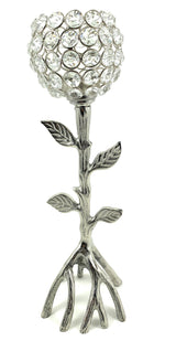 Silver candle holder shaped like a tree with branching roots as the base and a spherical top covered in round clear crystals.