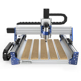 Front view of Genmitsu PROVerXL 4030 V2 desktop CNC router with aluminum frame, blue corner brackets, and wooden slats on the work surface.