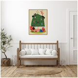 Framed canvas of a stylized green Christmas tree decorated with colorful ornaments, five black cats playing on and around it, and wrapped gifts at the base, hanging above a wooden bench with white cushions.