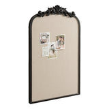 Arched pinboard with beige fabric and a detailed dark carved wood frame top, displaying four pinned photos arranged asymmetrically.