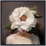 Portrait of a woman wearing a white top with her face obscured by a large, detailed white flower with green leaves against a muted gray background.