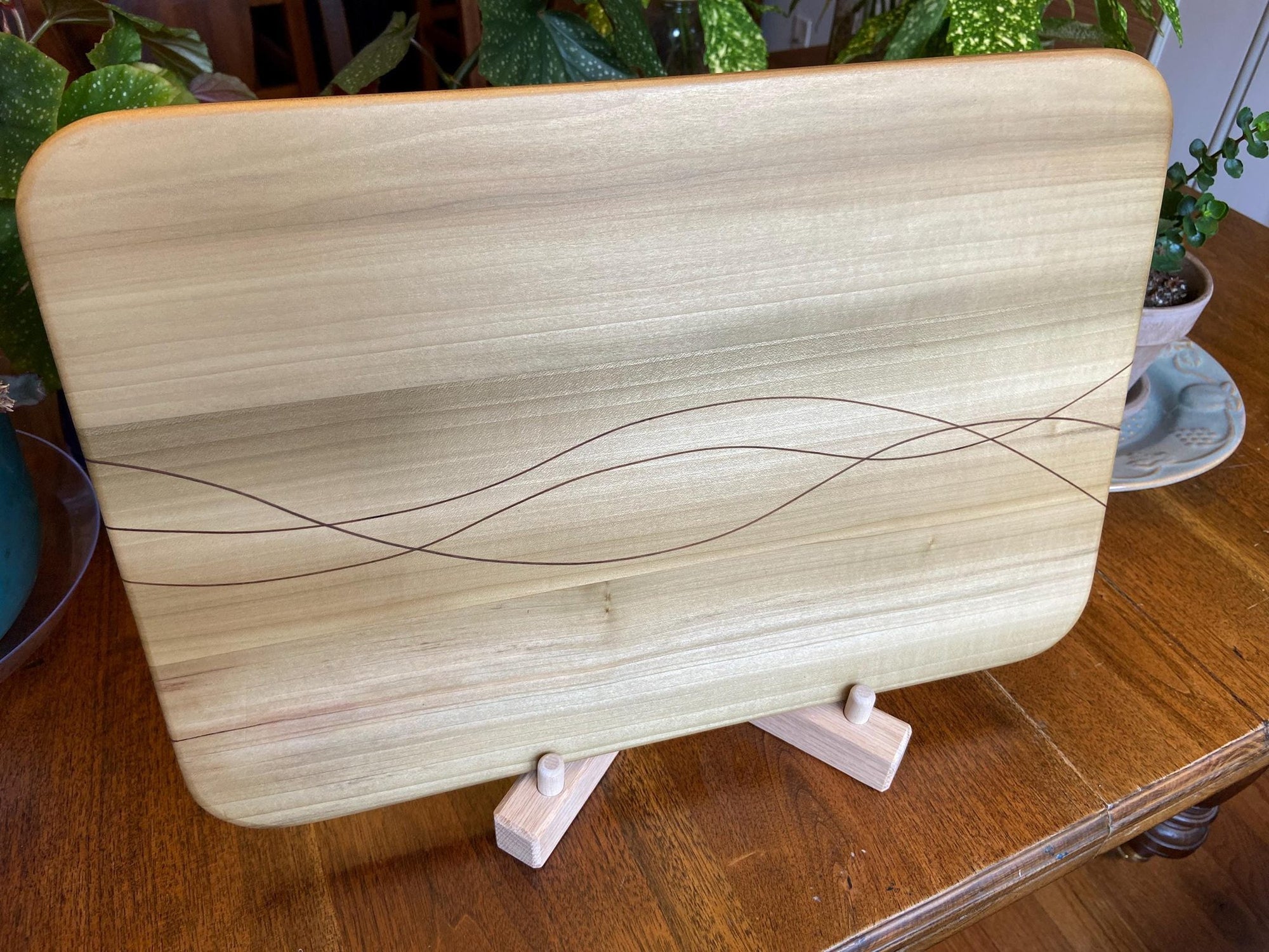 Handcrafted solid Poplar charcuterie board with Peruvian Walnut banding and inlay