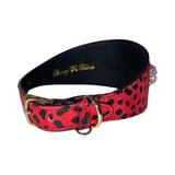 Red dog collar with black leopard print pattern, gold buckle and D-ring, lined with black fabric, featuring custom Swarovski crystal rivets on the side.