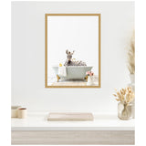 Framed canvas showing a zebra relaxing in a white clawfoot bathtub with a white towel and a rubber duck, set against a clean white background.