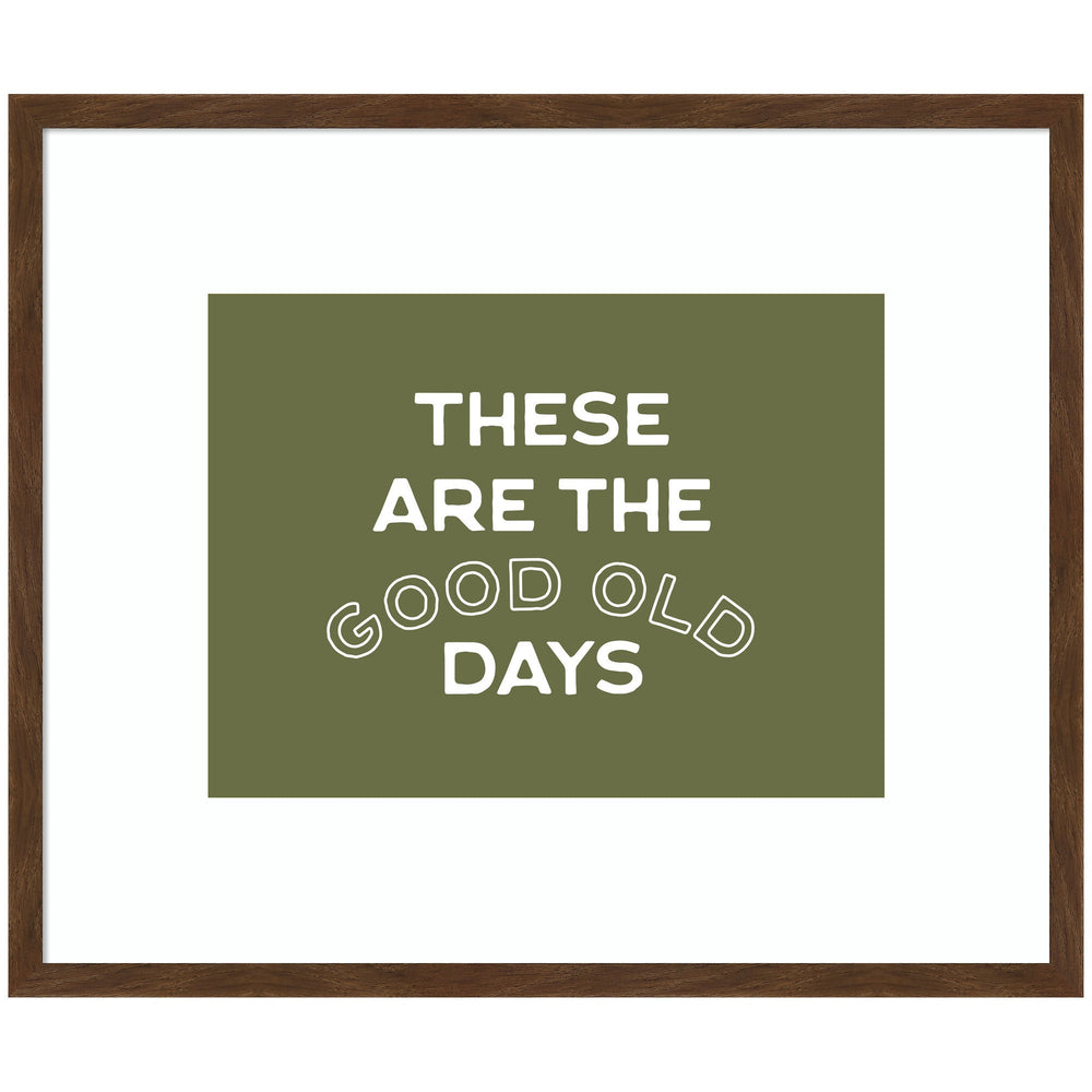 Framed wall art print titled 'These Are the Good Old Days' with stamped sage green lettering in a Carlisle Brown Narrow frame