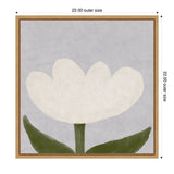 Minimalist white tulip with light green stem and two broad dark green leaves on a textured soft gray background, framed in light wood square frame.