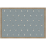 Rectangular fabric pinboard in muted blue with evenly spaced small white botanical block print motifs, framed in light wood tone.