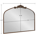 Rectangular wall mirror with an arched top and ornate bronze decorative crest, measuring 36 inches wide and 28.5 inches tall overall.