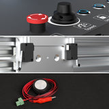 Composite image showing close-up controls with a red emergency stop button, a gray metal bracket mounted on aluminum rails, and a black circular sensor with red and green cables coiled on a black surface.