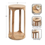 Tall cylindrical side table made of solid mango wood with a natural finish and arched legs connecting round top and base, dimensions 12 by 23 inches.