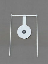 Rifle Spinner shooting target standing outdoors, showing metal circular plate on shaft