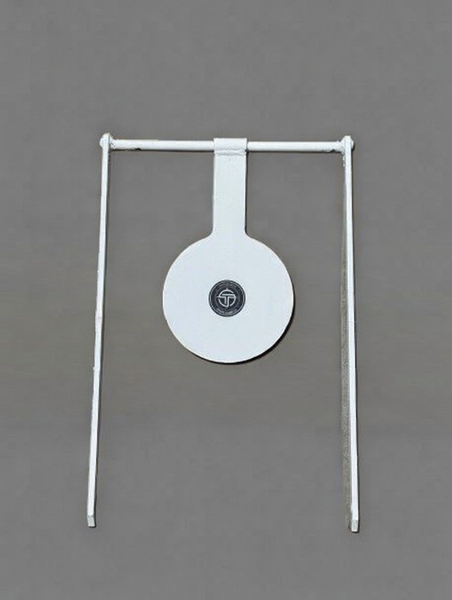 Rifle Spinner shooting target standing outdoors, showing metal circular plate on shaft