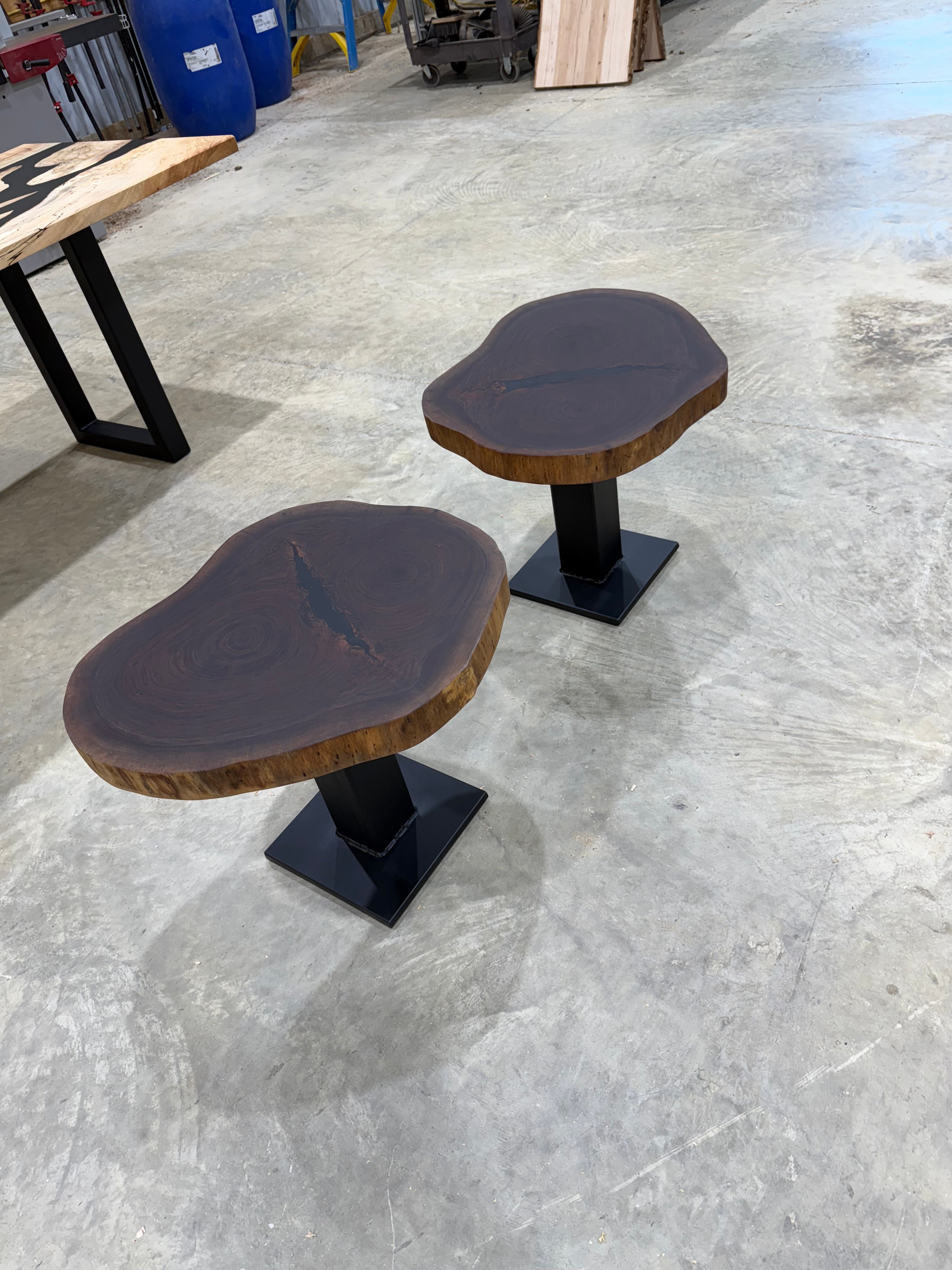 Walnut Cookie Side Tables with thick steel bases, handcrafted by Sasquatch Tables LLC