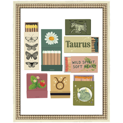Framed wall art print titled Taurus Matchbooks 14x18 FC by Megan Ryan in castellated distressed white frame