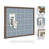 Rectangular wall pinboard with light blue plaid fabric and a brown wooden frame, featuring two black-and-white photographs pinned on it.