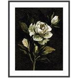 Framed floral artwork titled Moody Floral 2 by Annie Quigley, showing a light-petaled flower and green leaves on dark background in black narrow frame.