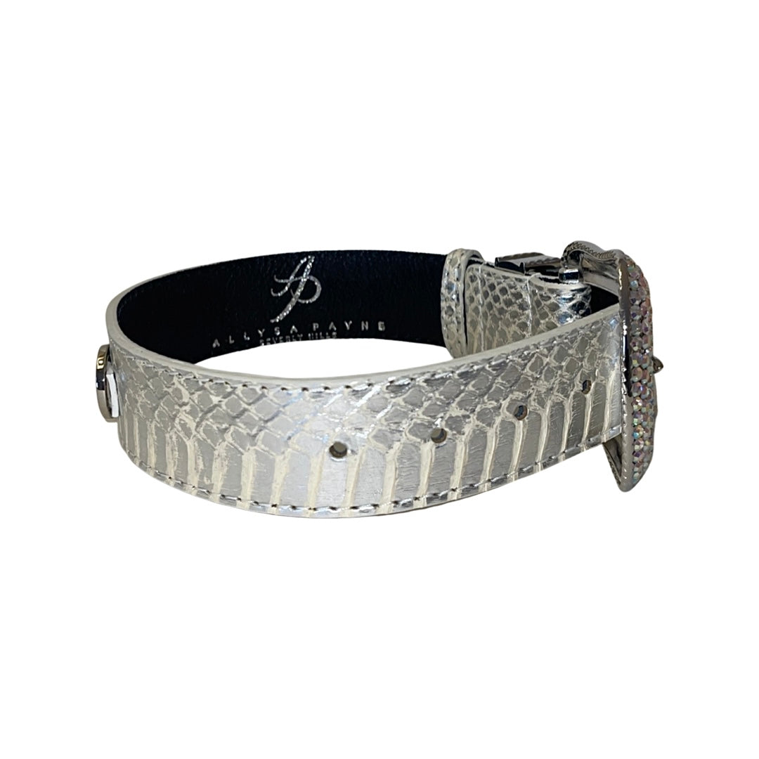 Silver snake-patterned collar with embedded Swarovski crystals on a wide, reflective band with an adjustable buckle and black interior lining.
