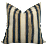 Square pillow cover with vertical stripes in cream, pebble beige, and deep navy blue, featuring textured fabric and a subtle woven pattern.