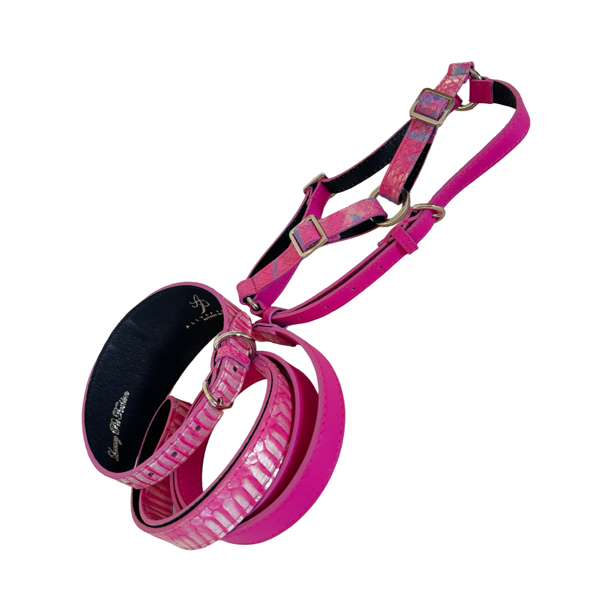 Pink pet harness, collar, and leash set with iridescent snake pattern details and gold-toned metal buckles, shown against a white background.